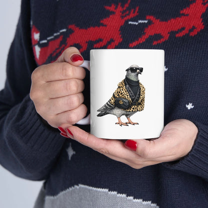 Person holding a mug with a pigeon design, wearing a sweater with deer pattern.