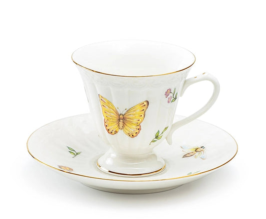 Teacup and saucer with butterfly design on a white background