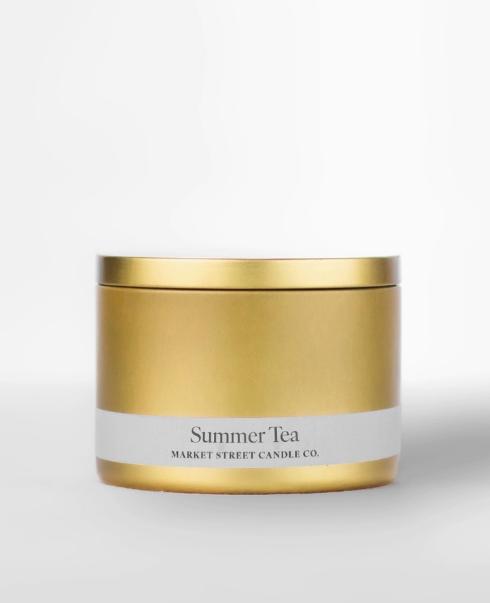 Market Street Candle Co. Summer Tea 8 oz Travel Tin soy candle in a sleek gold metal tin with matching lid and white label.