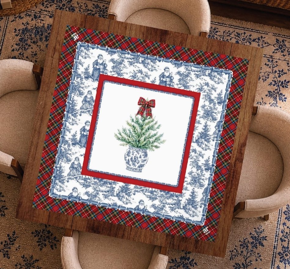 Tartan Toile Noël Christmas Mahjong mat displayed on a game table with red tartan plaid, blue-and-white toile and evergreen topiary design.