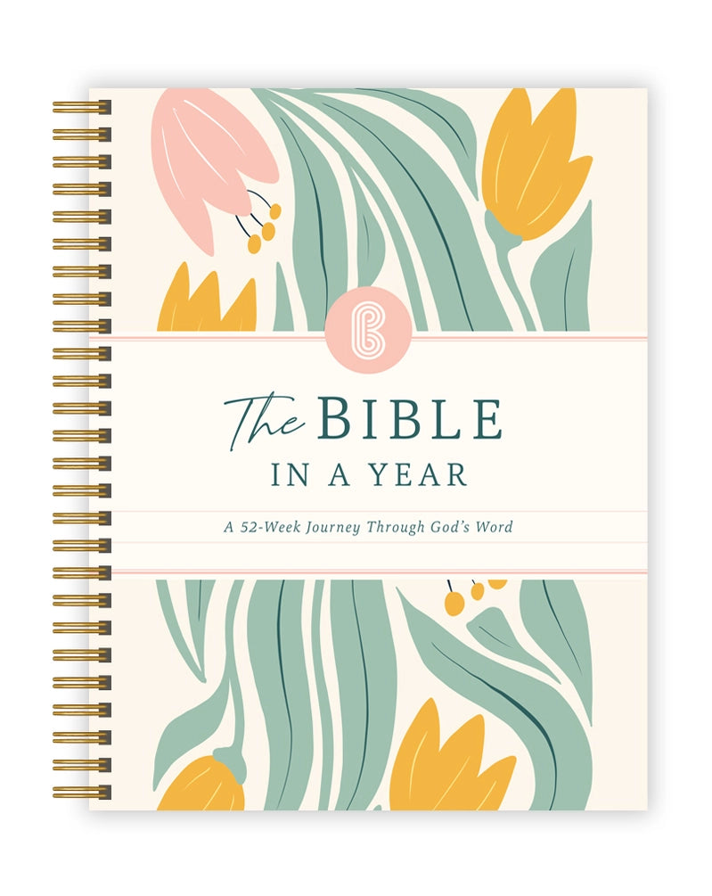 Floral design book titled 'The Bible in a Year' on a white background