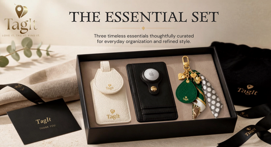 The Essentials Set featuring black leather AirTag wallet, ivory luggage tag and emerald green panther bag charm in gift presentation box