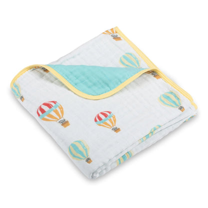 Baby blanket with hot air balloon pattern on a white background