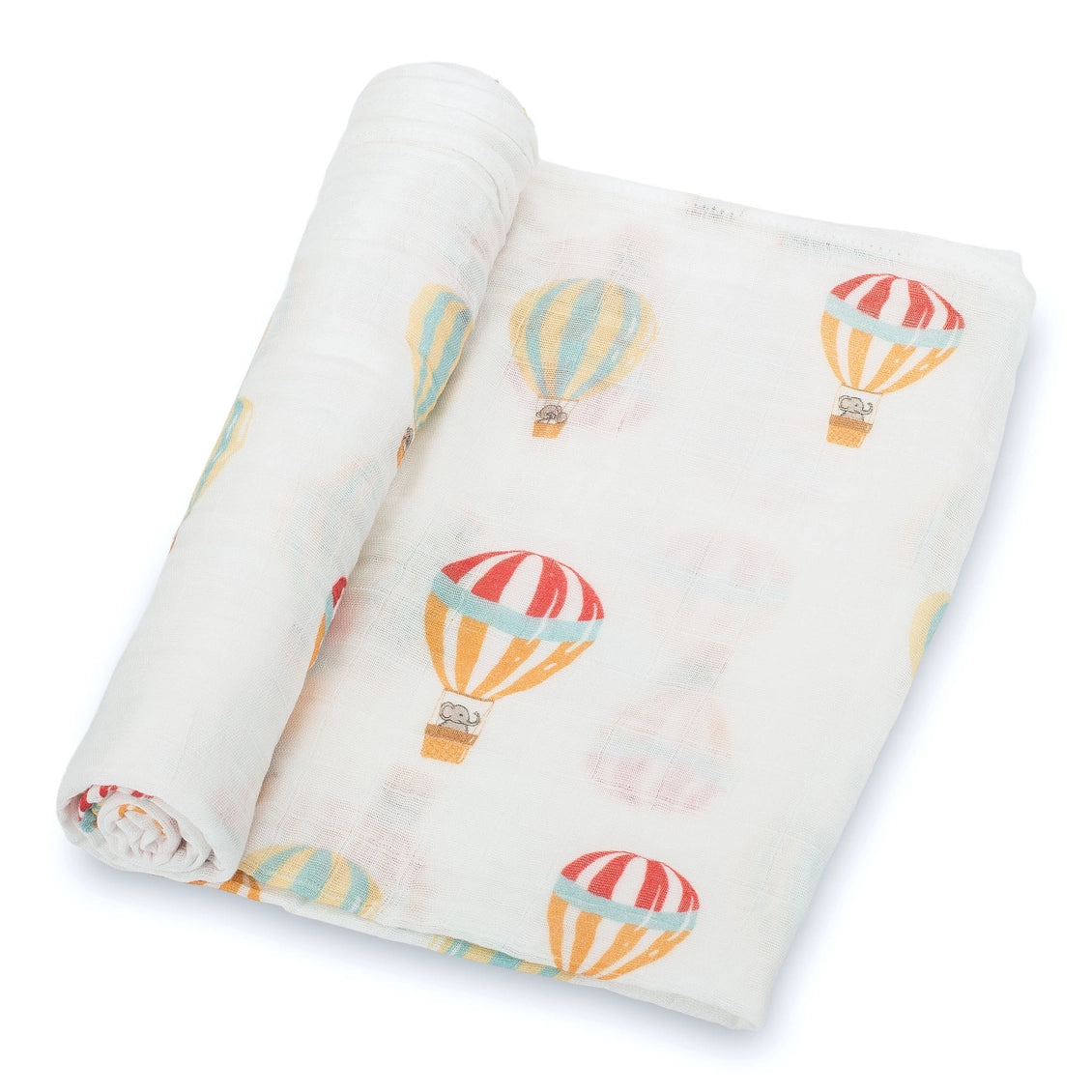 Rolled-up fabric with hot air balloon pattern on a white background