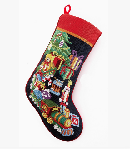 Toy Train needlepoint Christmas stocking with nutcracker, presents, teddy bear, Christmas tree and colorful holiday toys