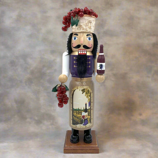 Nutcracker figure with wine-themed design on a white background
