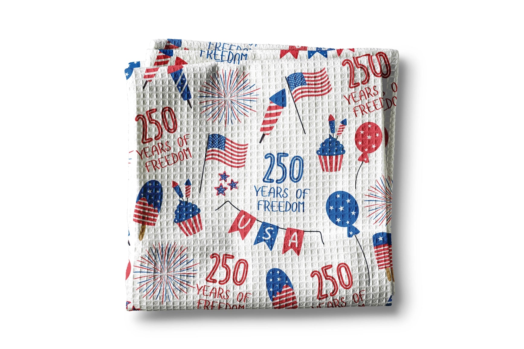 Woven blanket with 4th of July-themed design featuring stars, stripes, and '250 Years of Freedom' text on a white background.