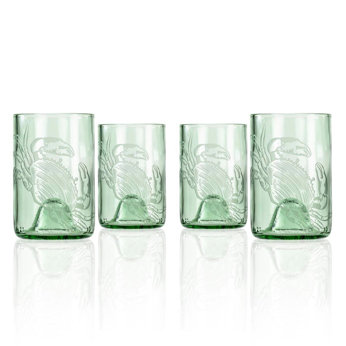 Set of four green glass tumblers with embossed design on a white background