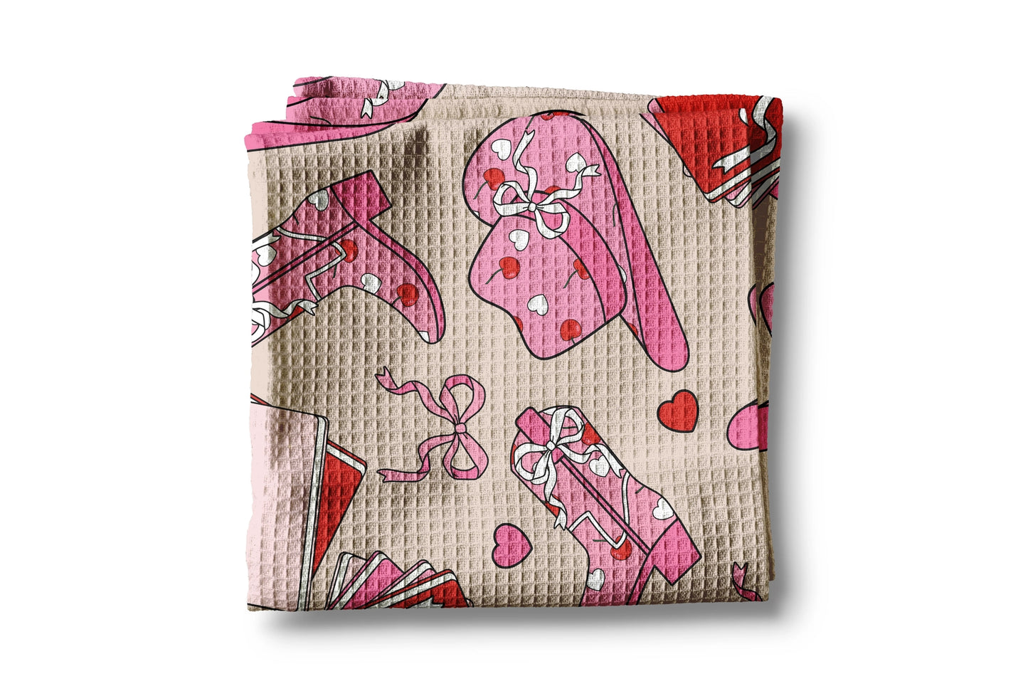 Waffle-textured blanket with pink cartoon characters on a beige background