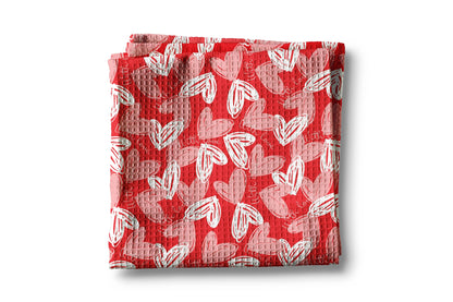 Red fabric with white heart pattern on a white background