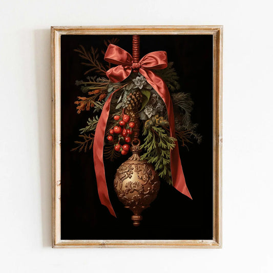 Framed artwork of a Christmas ornament with red ribbon and greenery on a dark background