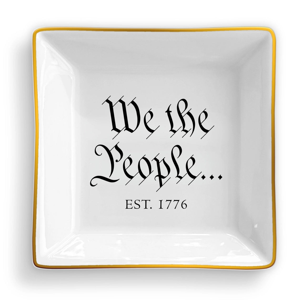 White decorative plate with 'We the People... Est. 1776' text on a white background