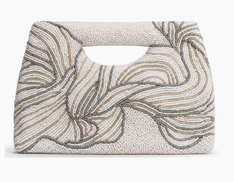 A structured handbag with a top handle, covered in cream-colored beads with wavy, flowing lines of dark brown and silver beadwork, set against a plain white background. NY Gift Boutique