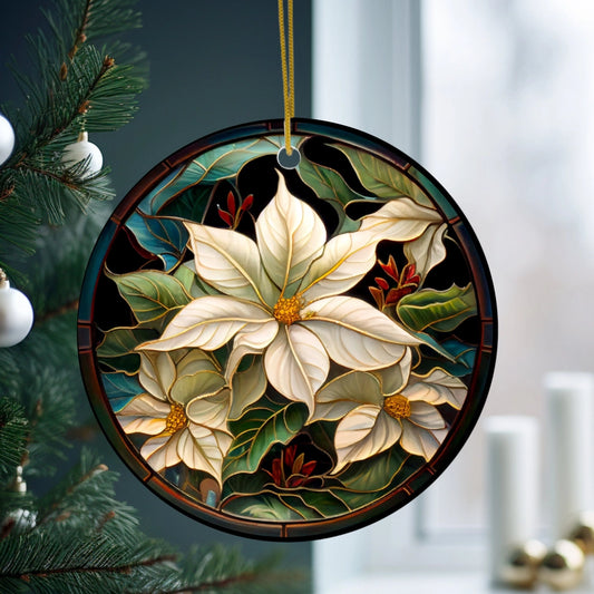 Decorative Christmas ornament with floral design hanging on a tree.