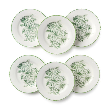 Set of six white plates with green floral patterns on a white background