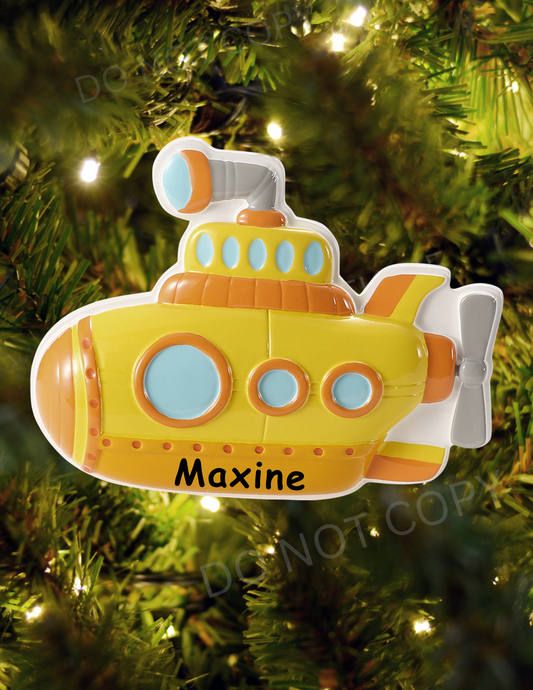 Yellow submarine ornament with 'Maxine' on a Christmas tree