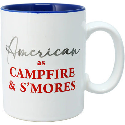 White mug with blue interior and text 'American as Campfire & S'mores'