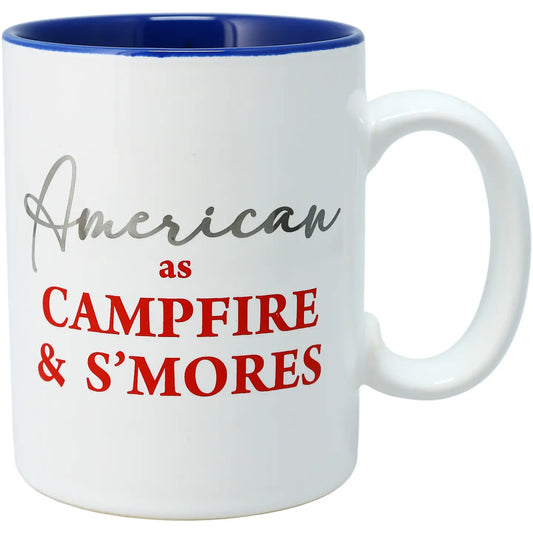White mug with blue interior and text 'American as Campfire & S'mores'