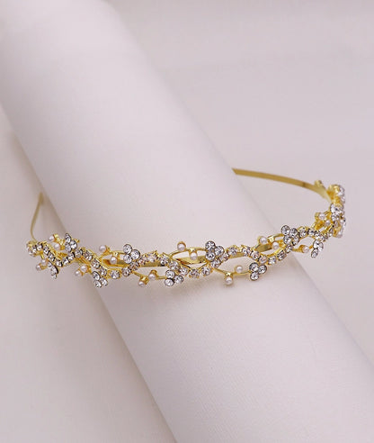 Gold and silver tiara on a white background