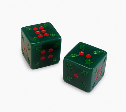 Pair of green Christmas Mahjong dice decorated with red holly berry pips and engraved holly leaves.