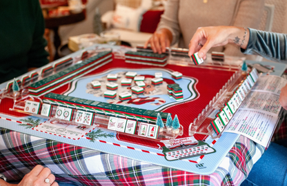Christmas Mahjong game night featuring Dear Santa holiday tiles with a coordinating festive Mahjong mat and acrylic tile racks.