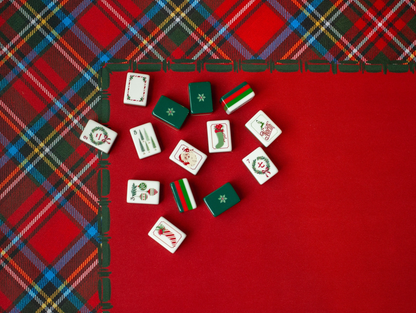 Dear Santa Mahjong tiles displayed on a red Christmas Mahjong mat with traditional tartan plaid border.