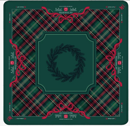 Evergreen & Tartan Christmas Mahjong mat by Anders Ruff featuring green tartan plaid, red ribbon bows and tonal evergreen wreath centerpiece.