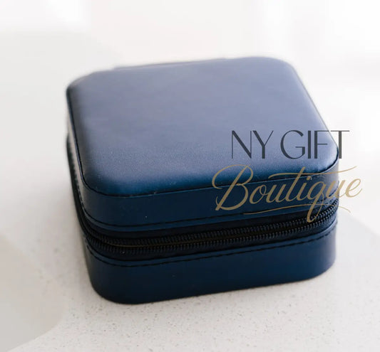 Blue jewelry box on a white surface with a white background