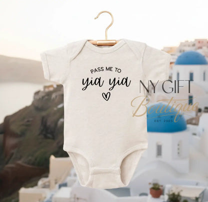 Beige baby onesie with text on a white background