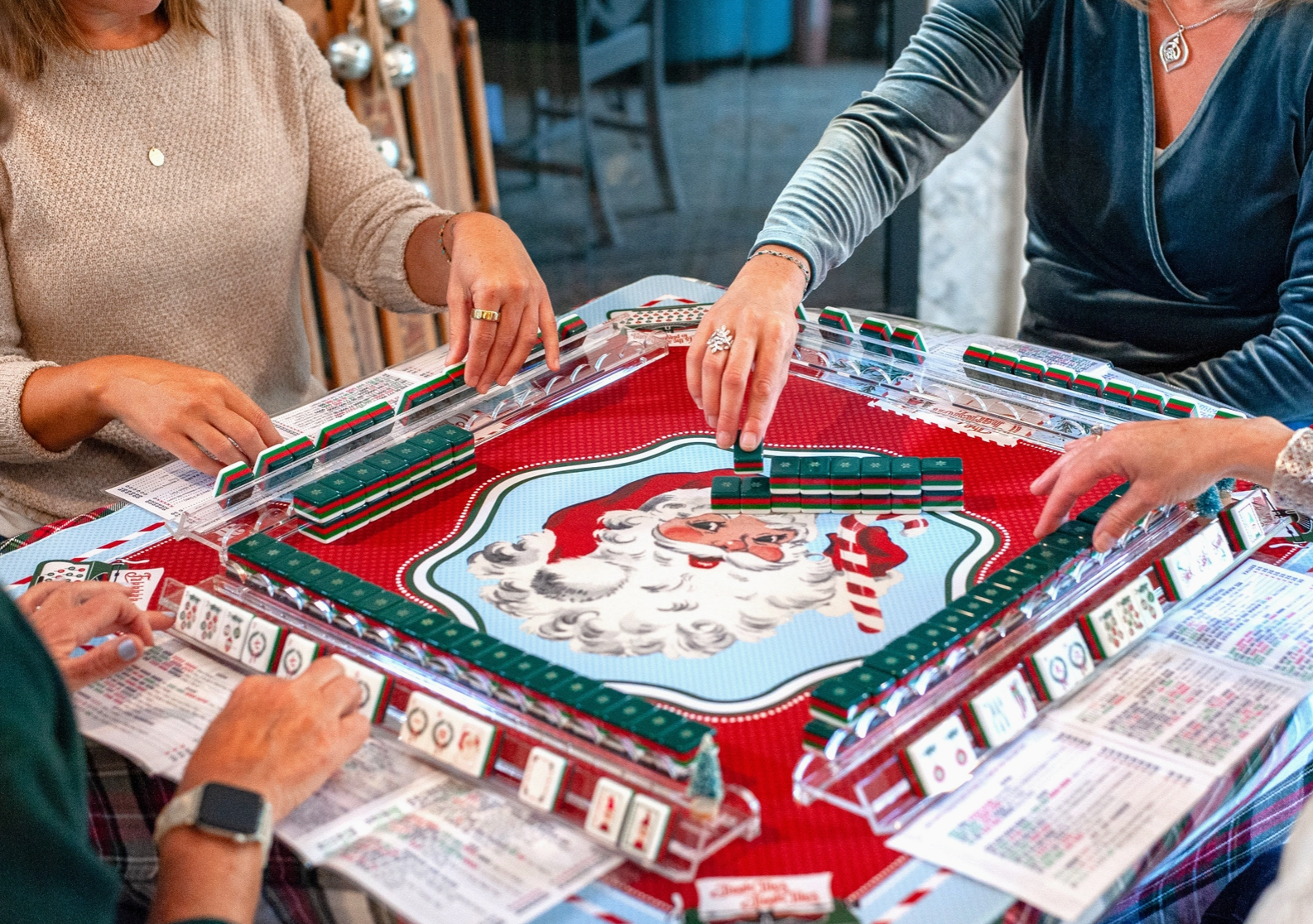 Santa's Mahjong Mail Christmas Mahjong mat displayed on a game table with vintage Santa and holiday postcard design.