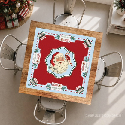 Santa's Mahjong Mail Christmas Mahjong mat displayed on a game table with vintage Santa and holiday postcard design.
